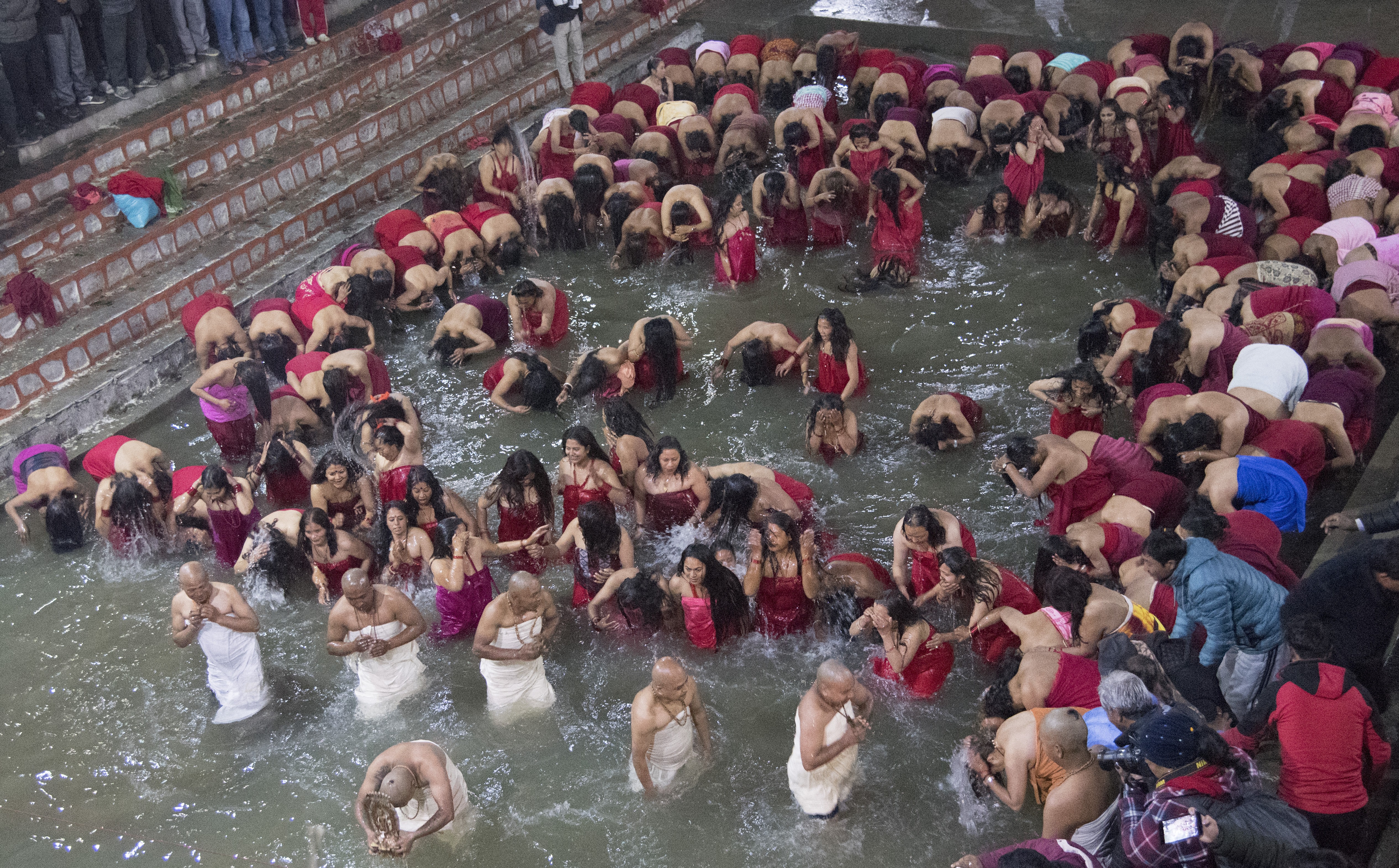 devotees-take-bath-in-the-salinadi-on-the-first-day-of-month-long-swasthani-fasting-sankhu-kathmandu